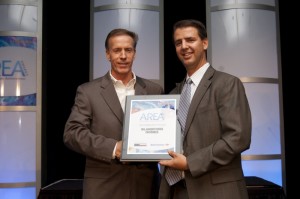 President of Blandford Homes, Jeff Blandford (l), is presented with the AREA Award for 2014 Home Builder of the Year.
