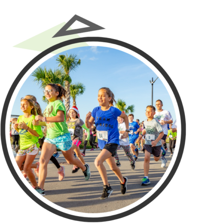 Kids in the street participating in an organized group run
